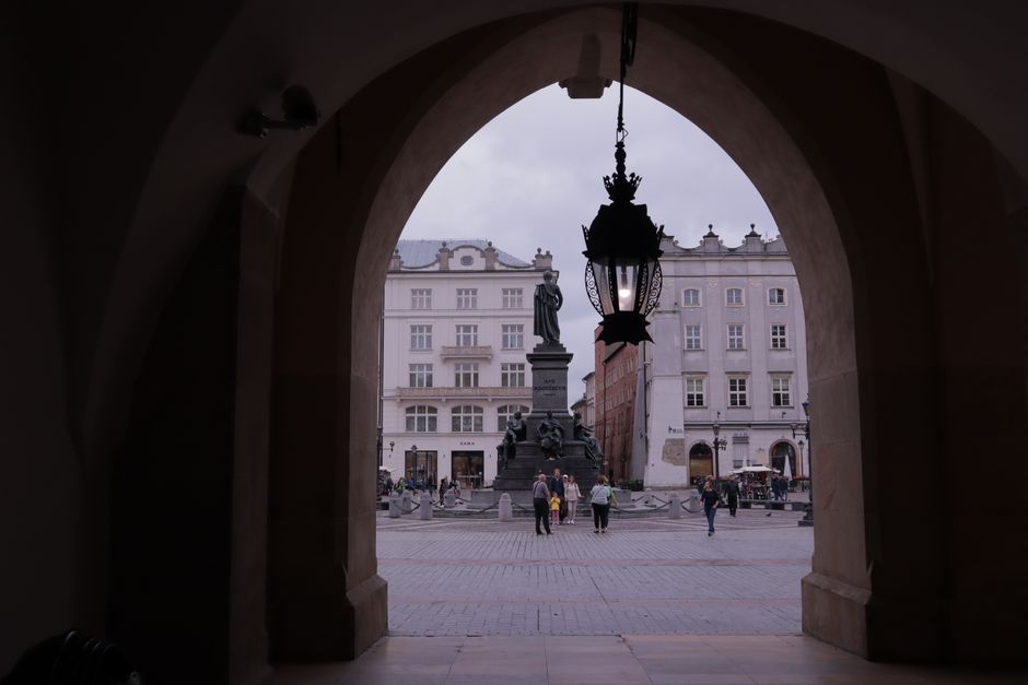 View of the Adam Mickiewicz Monument in Krakow's historic Old Town