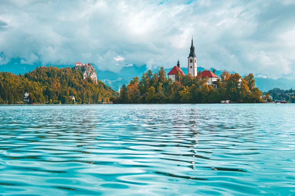 Landscape of Lake Bled with iconic church and mountain backdrop