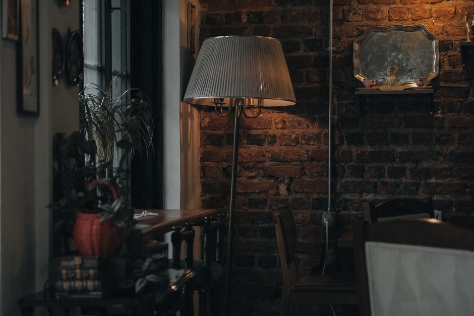 Warm and inviting living room with vintage decor and soft lamp lighting